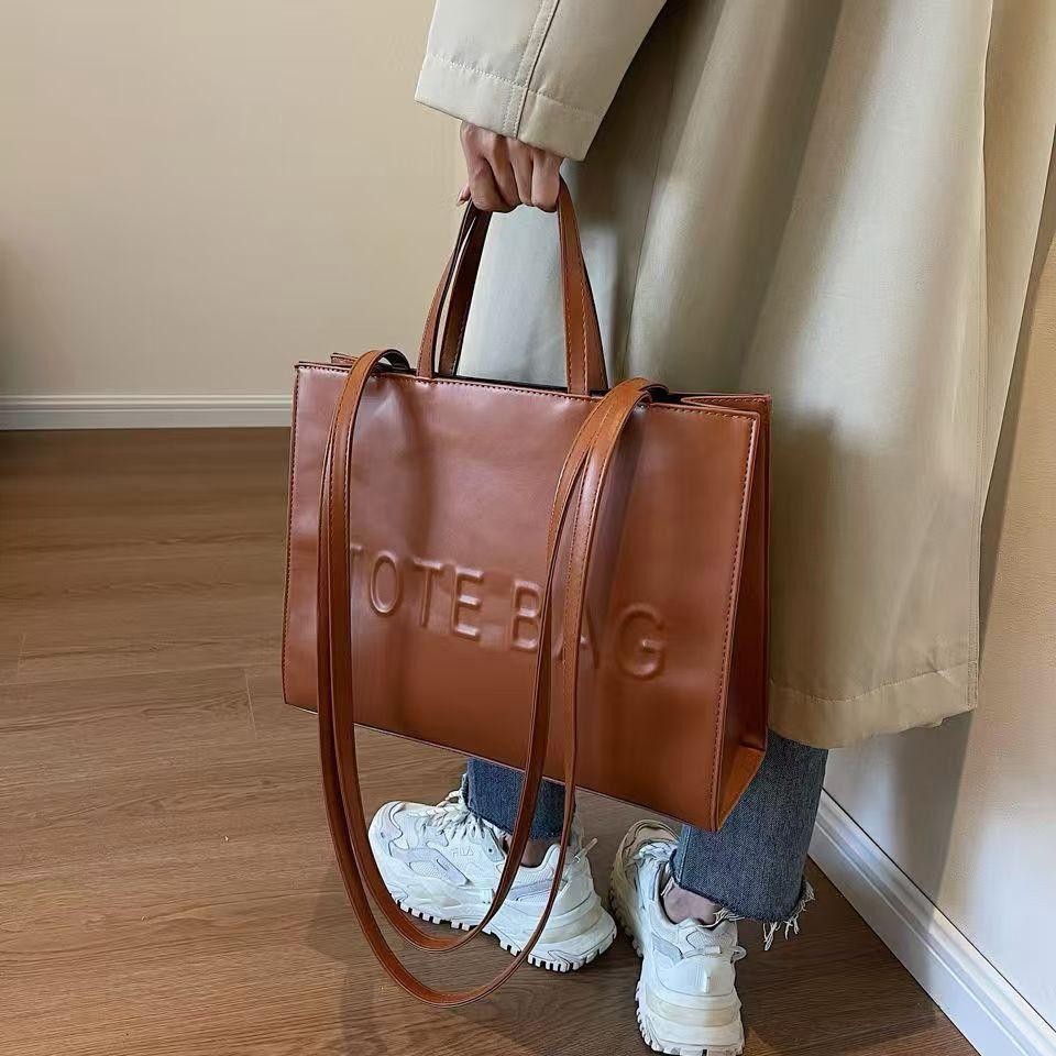 Spacious leather tote bag interior view, work and casual use