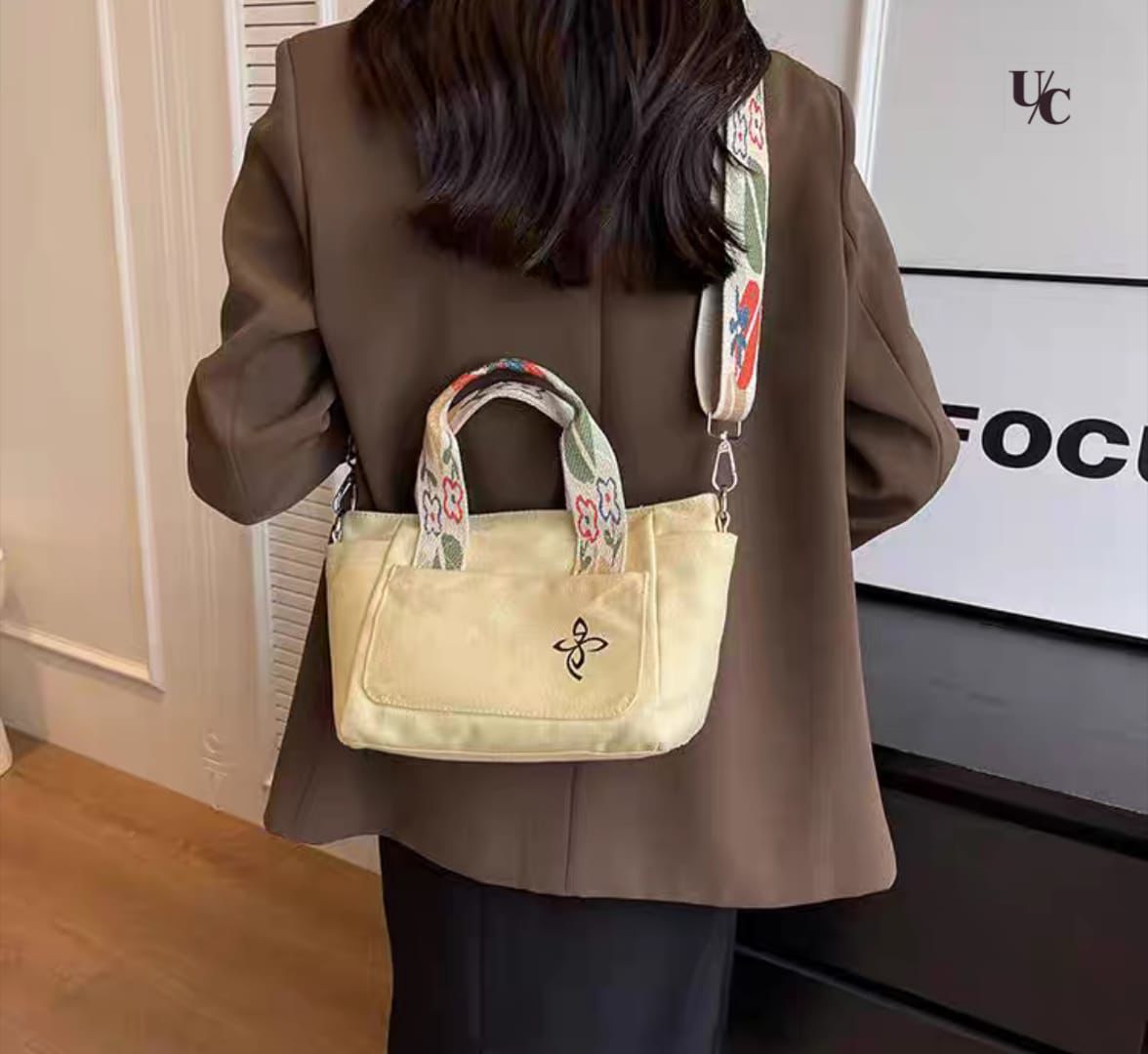 Multi compartment canvas bucket bag with interior pockets